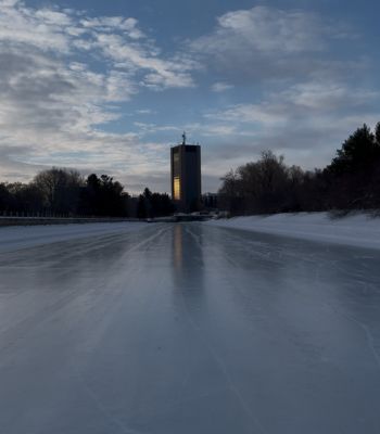 Icy Rideau Canal with Dunton Tower in the distance.