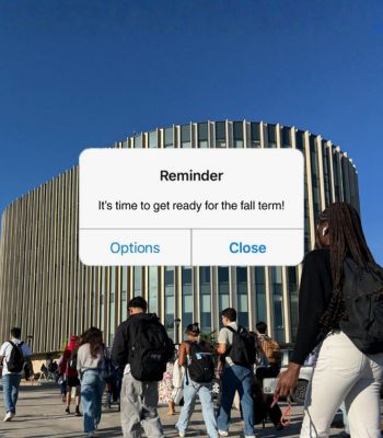 An image of students walking toward campus buildings, with a reminder notification pop-up on the screen.
