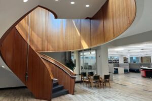 The first floor of the MacOdrum library and the bottom of its staircase.