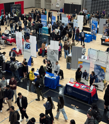 An aerial shot of students and employers at the career fair.